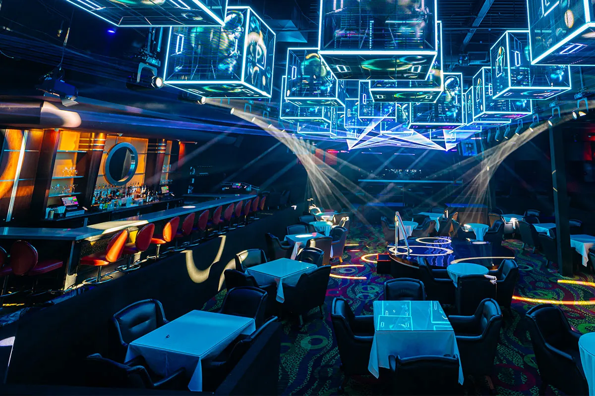 The Cheetah main floor with blue-lit tables and neon cube light installations