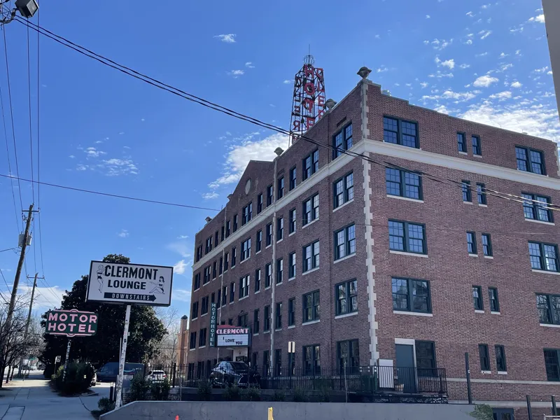 Hotel Clermont building on Ponce de Leon Avenue with the Clermont Lounge sign at street level