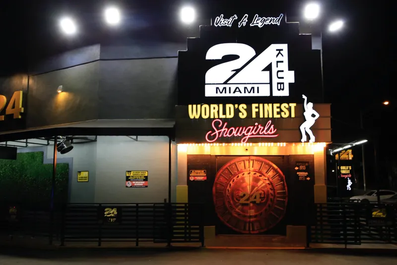Klub 24 Miami entrance at night with illuminated signage and vault-style door