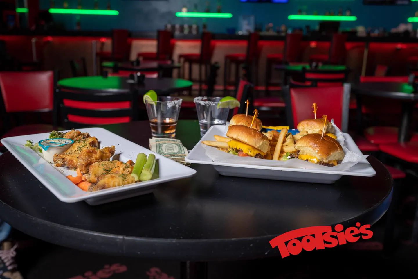Chicken wings and sliders served at a table at Tootsie's Cabaret